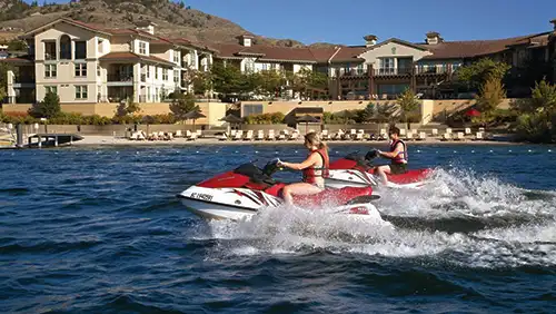Jet skiing on the private beach at Walnut Beach Resort